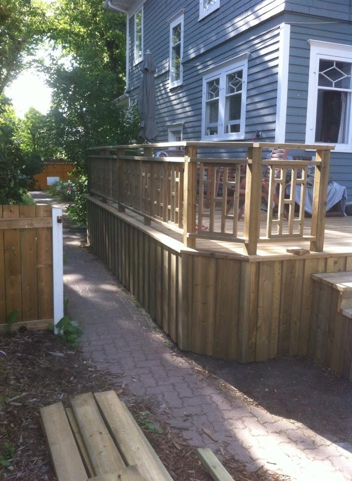 Large backyard deck with custom railing and privacy skirting
